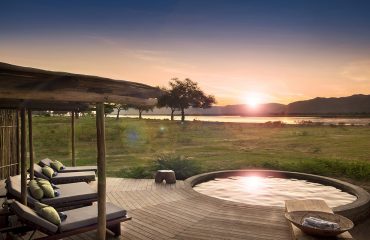Nyamutsi Camp's pool with a view overlooking the Zambezi and distant escarpment.